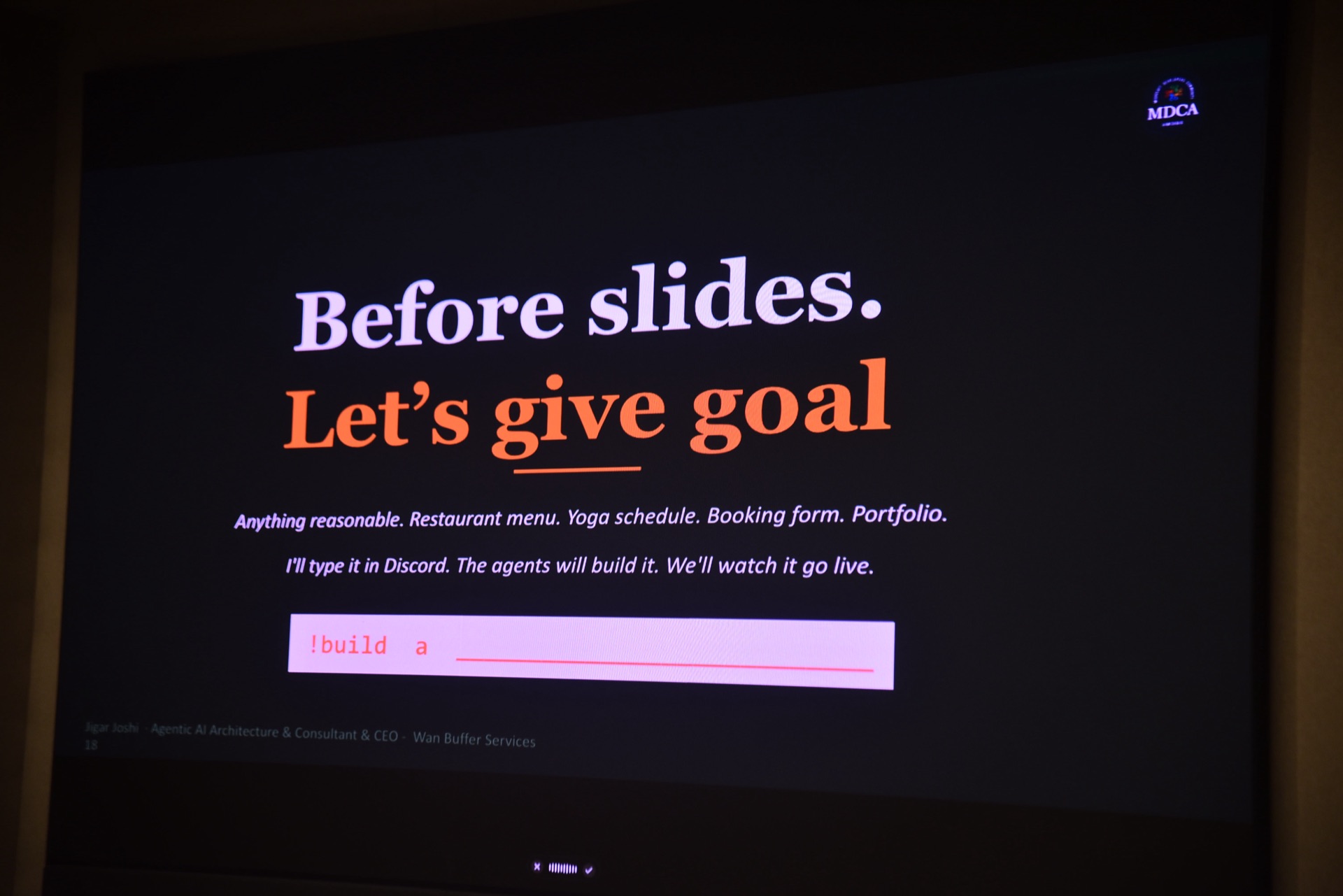 Slide reading "Before slides. Let's give goal" — live build prompt-driven demo at MDCA DOT NET DAY 11