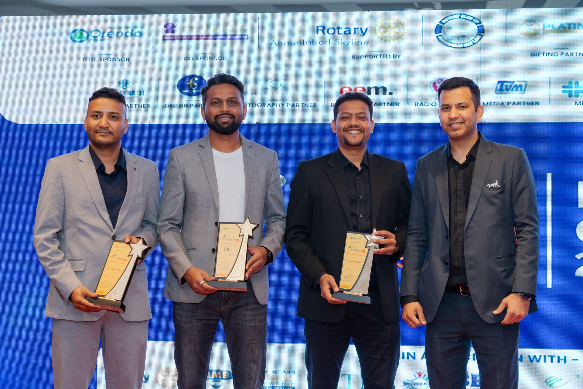 Jigar Joshi with fellow speakers and trophies at the Networkers Mahakumbh 2.0 Business Conclave 2026