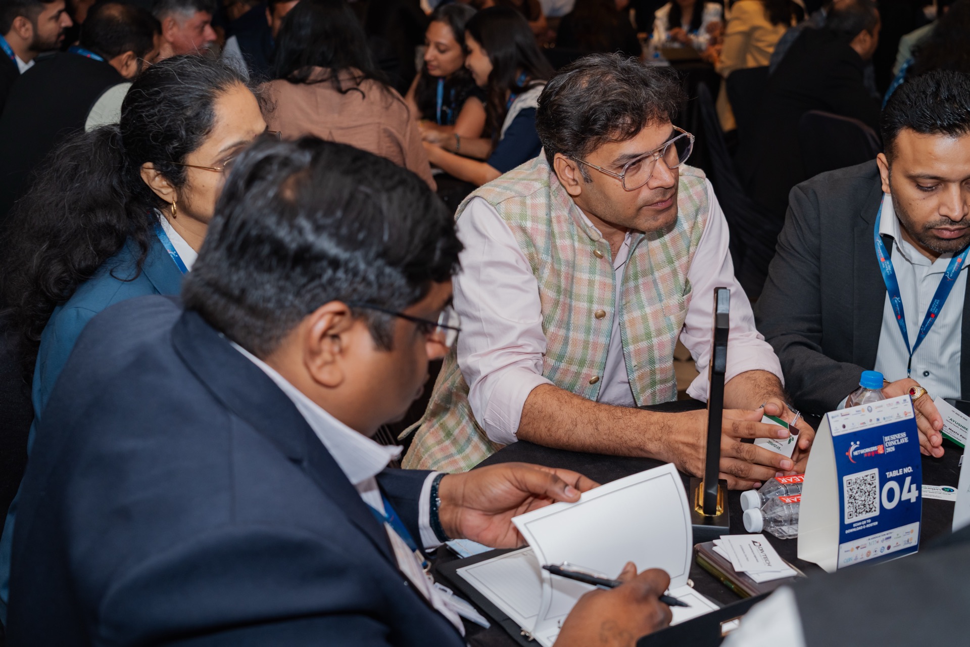 One-to-one networking activity at a numbered table during Networkers Mahakumbh 2.0 Business Conclave in Ahmedabad